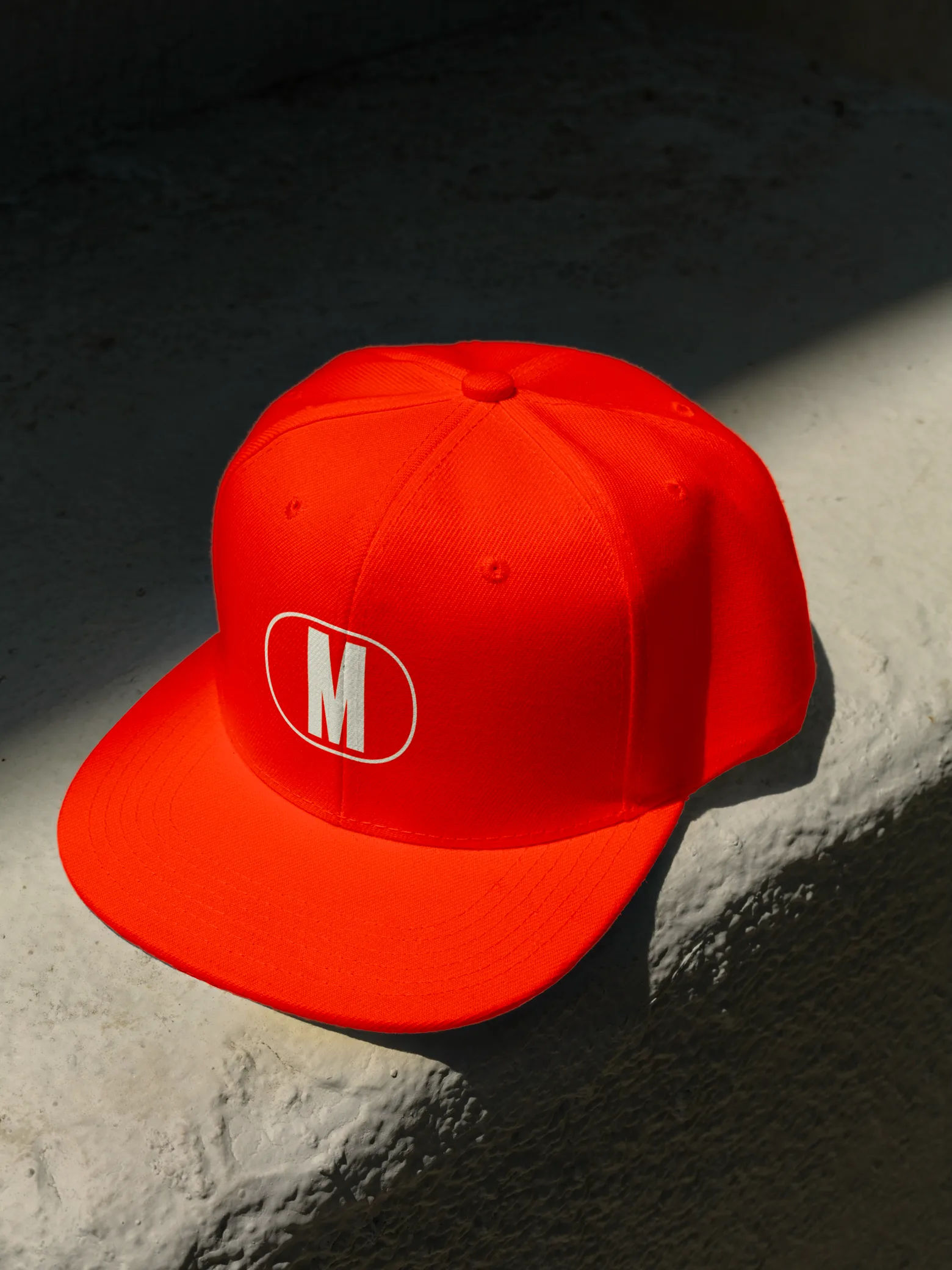 Monumental — branded cap